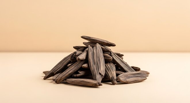 oud wood chips on solid pastel beige background