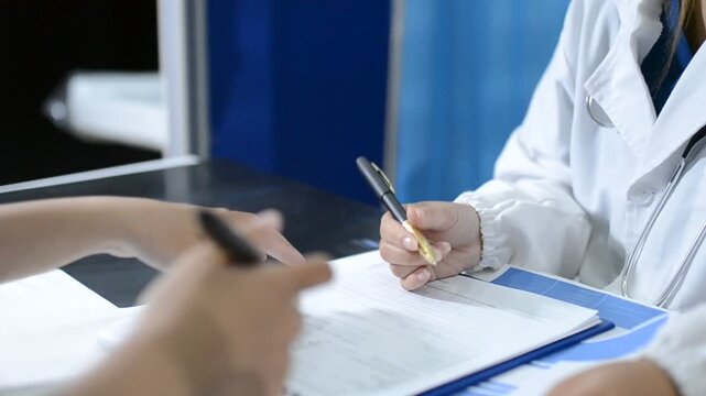 Multiracial doctors team advising about the treatment of patient using x-ray scan during meeting in office clinicMultiracial doctors team 