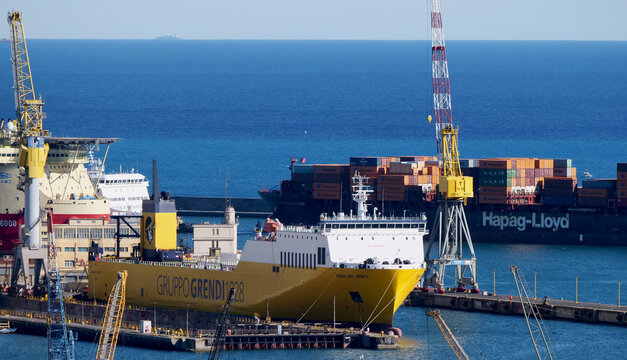 Genoa, Italy - June 2026: View of the port with the Grendi Group Ro-Ro ship and the Hapag-Lloyd container ship. 