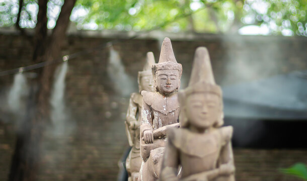 Statues of Buddha in the temple of Thailand, selective focus.