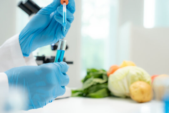 Scientist check chemical fruit residues in laboratory. Control experts inspect the concentration of chemical residues. hazards, standard, find prohibited substances, contaminate, Microbiologist