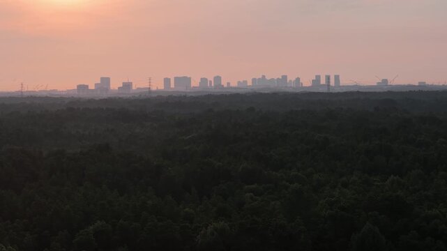 Aerial Drone View of Mangrove Forest and Johor Bahru Skyline at Sunset
