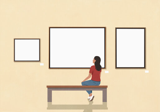 Young woman sitting on bench looking at art hanging on wall in museum
