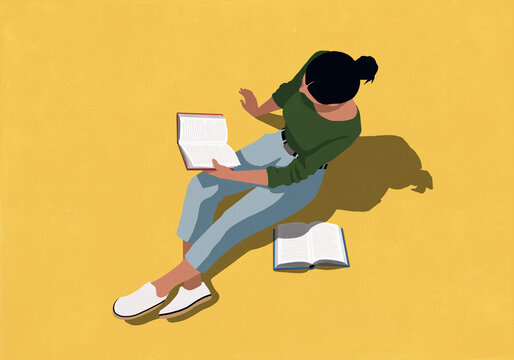 Woman reading books against yellow background