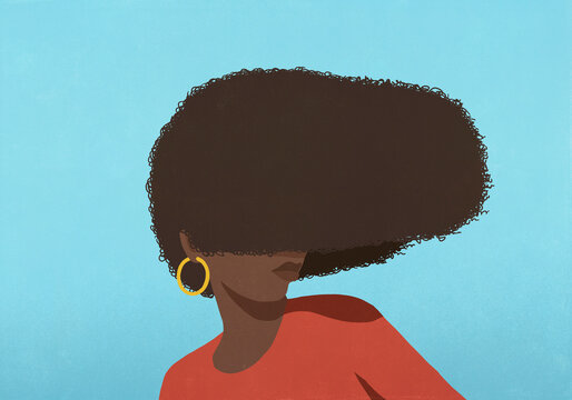 Woman's curly hair covering face