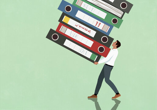 Businessman carrying large stack of files against green background