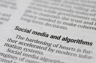 Fototapeta premium Newspaper headline social media and algorithms close up macro shot