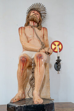 The bloodied legs and knees of Jesus Christ on his way to the crucifixion.