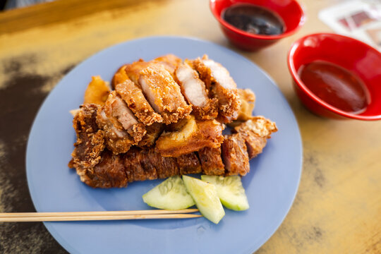 Lor bak Penang five-spice fried pork rolls with dipping sauce, Malaysian Chinese hawker food.