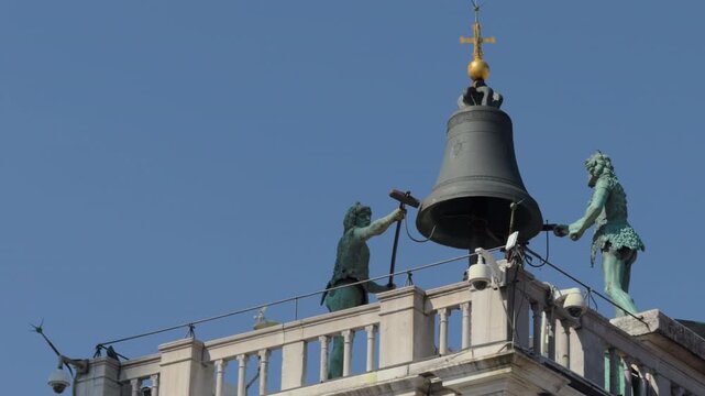 Venetian Bell Tower With Bronze Figures And Golden Cross