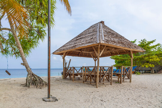 The beach scene with gazebo on the beach under palm tree