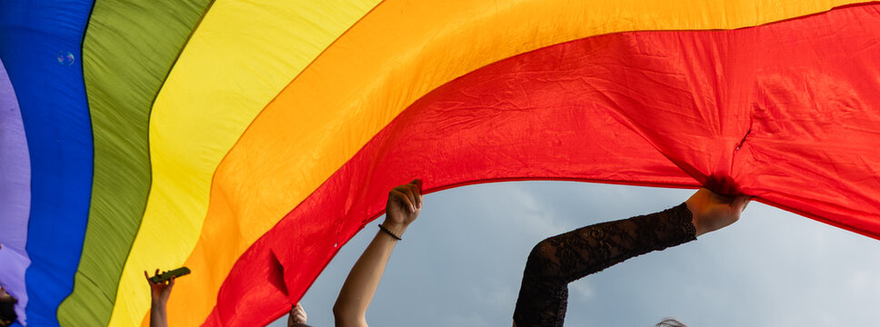 pride with rainbow flag - symbol of love and tolerance