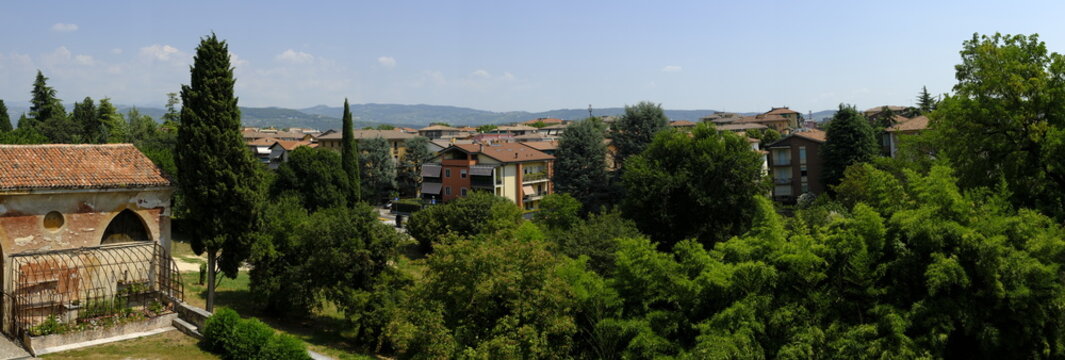 Panoramic view of Verona suburbs with houses and green trees