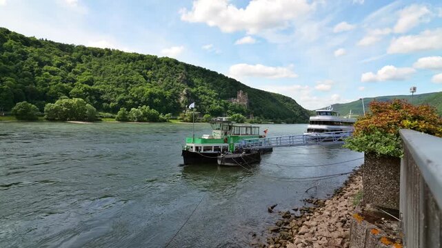 Rhine landscape near Assmannshausen with excursion boats and forested hillsides along the river