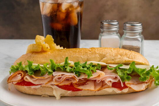 ham sub  with french fries and  soda