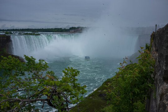 Tourist explore on a boat the famous Niagara Falls