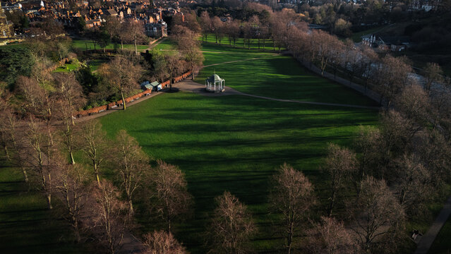 Golden Hour Aerial View of The Quarry Park with bandstand and Severn River, Shrewsbury, England, UK
