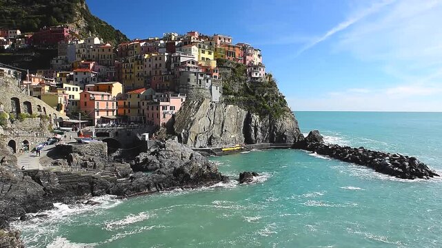 Manarola Cinque Terre Coastal Village Liguria Italy is a small coastal town in Liguria, Northern Italy, and one of the iconic Cinque Terre villages. Famous for its colourful cliffside houses, charming
