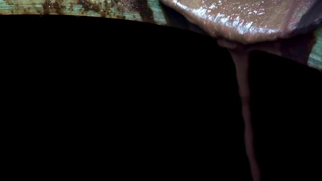 Thick waste grease pours down pipe