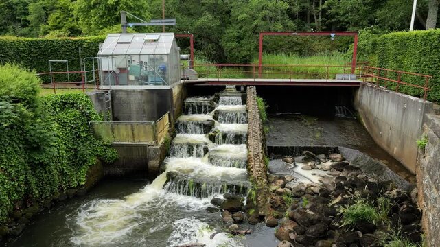 Water flowing down fish ladder at small hydroelectric power plant