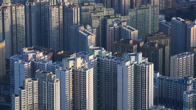Overlooking the dense apartment buildings in Kowloon, Hong Kong, this aerial urban view captures the incredible city density and vertical architecture that define the city&rsquo;s landscape.