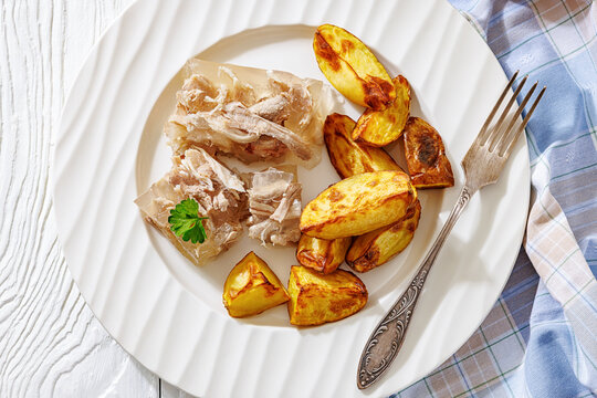 Cold meat aspic plate with crispy potatoes