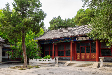 Fototapeta premium Traditional Chinese Courtyard Pavilion of Yulan Xuan Surrounded by Mature Trees at Beihai Park in Beijing, China