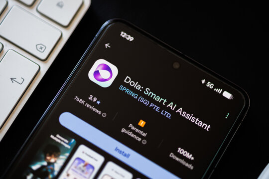Mobile phone displaying Dola Smart AI Assistant on Google Play store in lifestyle situation