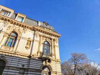 Ornate historic building facade against blue sky © Studio-M