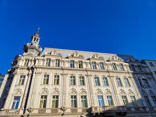 Ornate historic building facade against blue sky © Studio-M