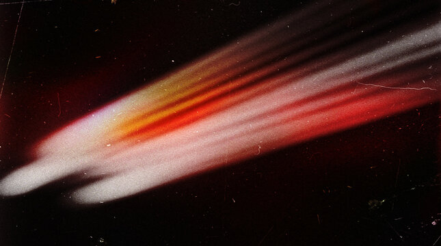 Vintage Analog Film Grunge Background with Warm Red Orange Light Streak, Diagonal Motion Blur, Film Grain and Scratches on Dark Black Texture
