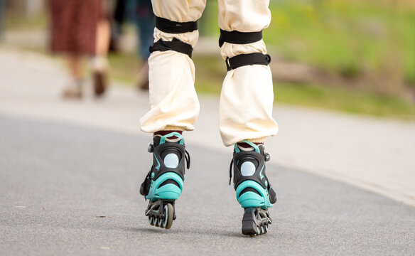 Teen Skating On Path In Park