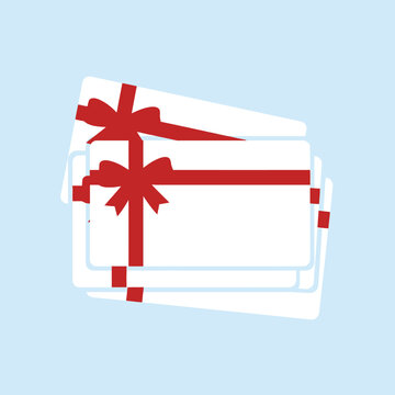 A stack of white gift cards with red ribbons and bows