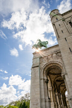 Paris's Sacre-Coeur Basilica with stunning architecture against a vibrant sky, located in Montmartre, France.