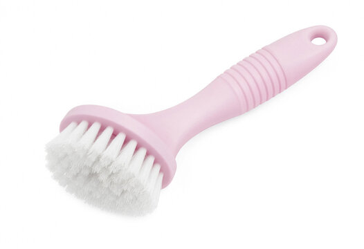 Pink dish washing brush with white bristles isolated on white background