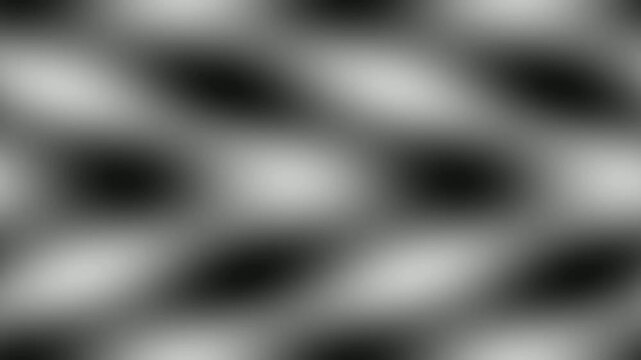 Abstract background with a repeating pattern of blurred dark and light shapes.