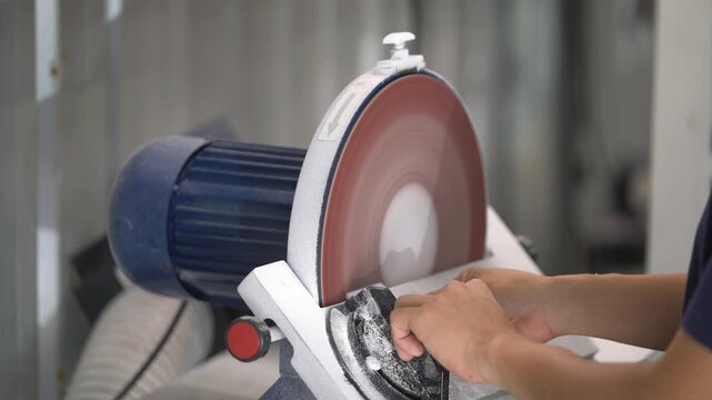 Sanding and Shaping Acrylic Letters with Disc Sander During Sign Production