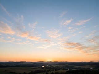 Fototapeta premium Golden hour landscape rolling hills and dramatic sky