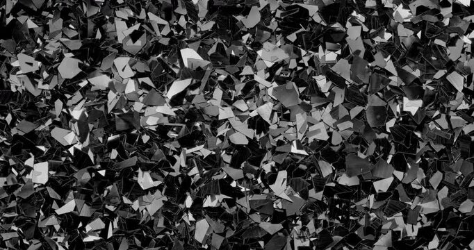 Iridescent holographic flakes slow rotation. Close-up of dense shiny fragments.
