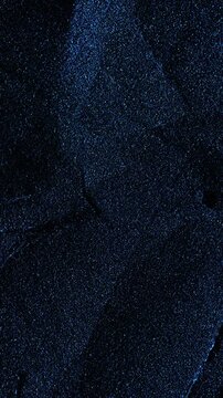 Dark cracked texture slow rotation. Close-up of deep black surface with intricate white vein patterns and natural cracks. Smooth continuous rotation reveals evolving light reflections.