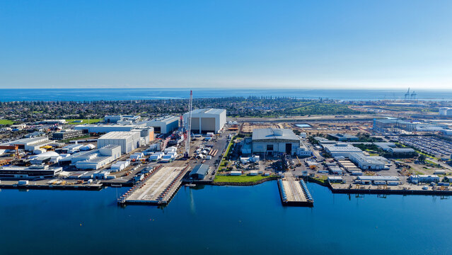 Osborne, Adelaide, South Australia &ndash; 4K aerial drone view of Port Adelaide River, industrial waterfront, ASC Shipyard, maritime facilities, coastal wetlands and North Haven.