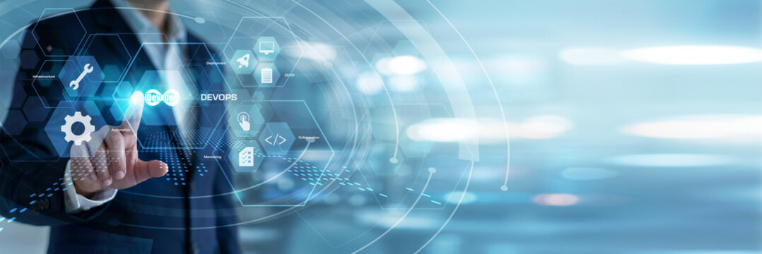 Systems engineer organizing and touching DevOps pipeline structures on a dark mode virtual screen to deploy software faster. Continuous integration, code deployment, and agile processes.