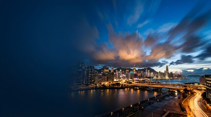 Fototapeta premium Panoramic Hong Kong skyline at night with long exposure light trails