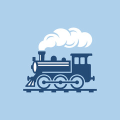 A blue vintage steam locomotive travels on a railway track © mahame