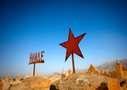 Rusty Red Star Sign On A Grave Of A Cemetery In Kochkor Area, Kyrgyzstan