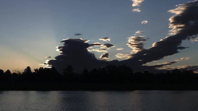 Morning Sun Emerging Behind Storm Clouds Timelapse