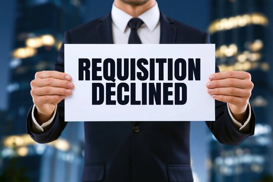 Corporate businessman holding a white paper document with the text requisition declined