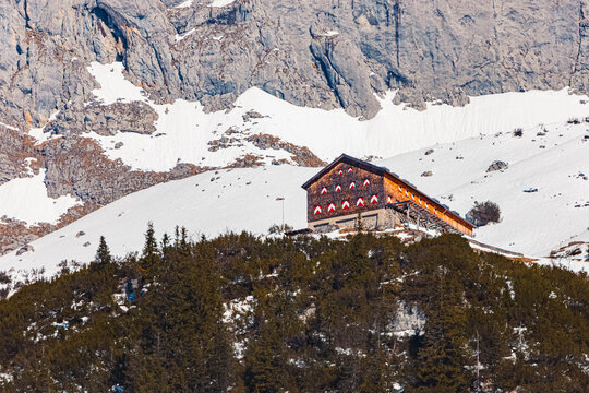 Alpine spring view with a far view of Gruttenhuette hut seen from Wochenbrunner Alm, Mount Wilder Kaiser, Ellmau, Kufstein, Tyrol, Austria