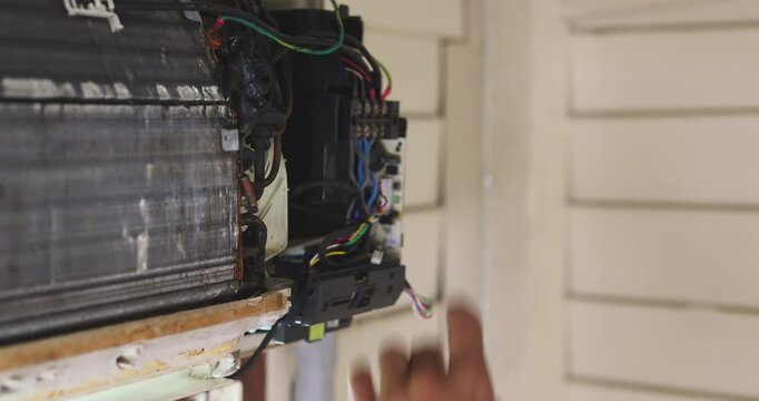 Mechanic man repair and clean air condition in city home diagnostic electronic industry