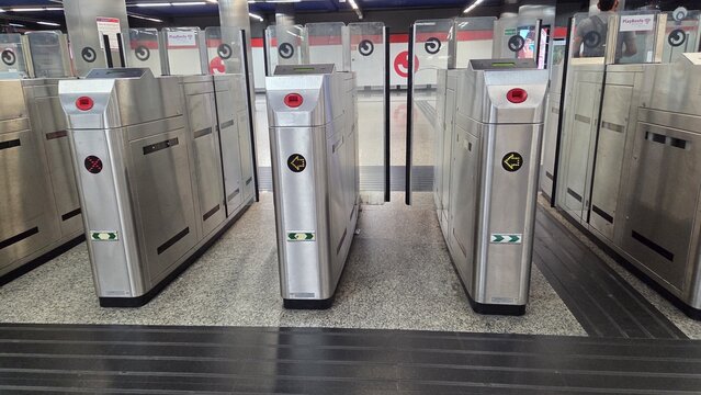 MADRID, SPAIN - JUNE, 22, 2026. Close up view of stainless steel turnstiles at madrid cercanias renfe commuter station for transport banner and background. Nuevos Miinisterios Cercanias station